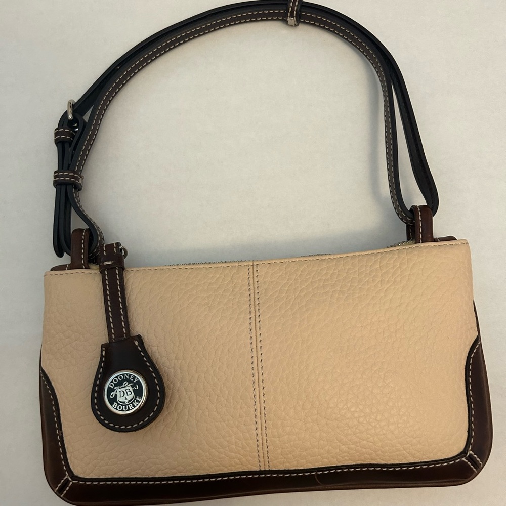Gently used Dooney & Bourke small purse in white and brown all weather leather